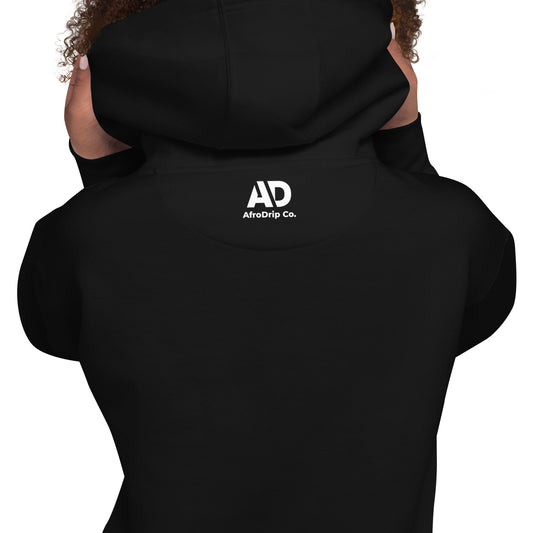 Close-up detail of the AfroDrip embroidered logo on the black Classic Unisex Pullover Hoodie
