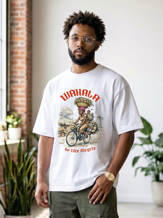 AfroDrip 'Wahala Be Like Bicycle' Unisex Premium T-Shirt in white, lifestyle view showing the bicycle-themed Afrobeats graphic print