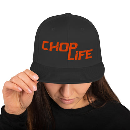 AfroDrip 'Chop Life' Snapback Hat in black, front view showing embroidered 'Chop Life' text or logo on the crown
