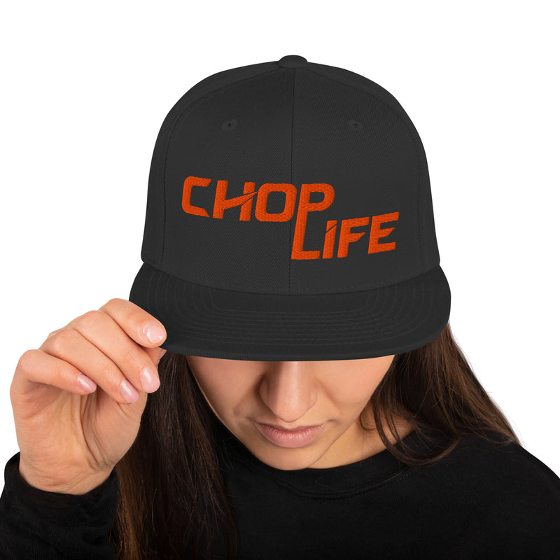 AfroDrip 'Chop Life' Snapback Hat in black, front view showing embroidered 'Chop Life' text or logo on the crown