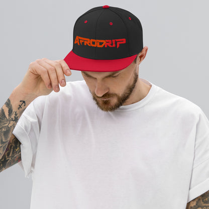 AfroDrip Classic Snapback Hat in black with red brim accent, front view showing embroidered AfroDrip logo