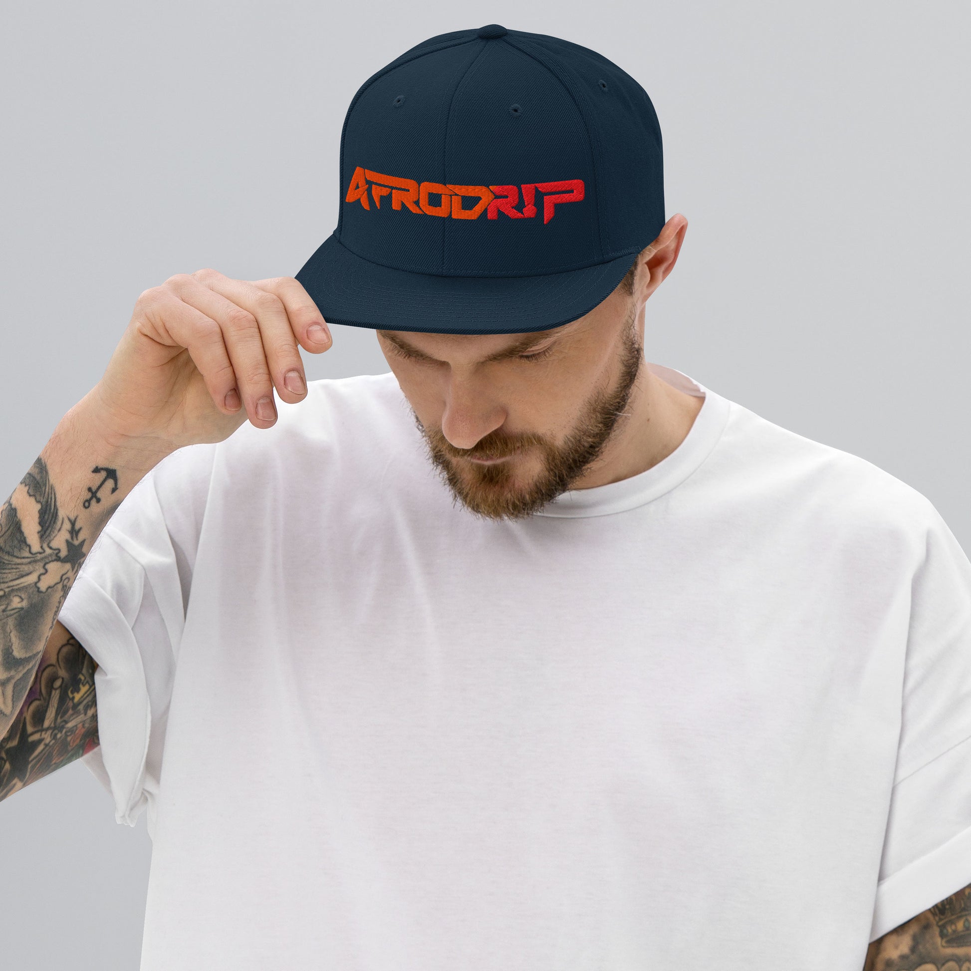 AfroDrip Classic Snapback Hat in black, front view showing embroidered AfroDrip logo on the crown panel