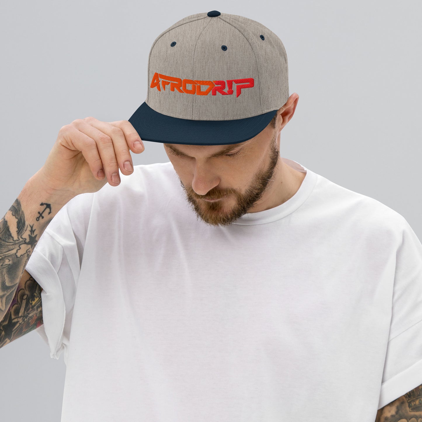 AfroDrip Classic Snapback Hat in black, front view showing embroidered AfroDrip logo on the crown panel
