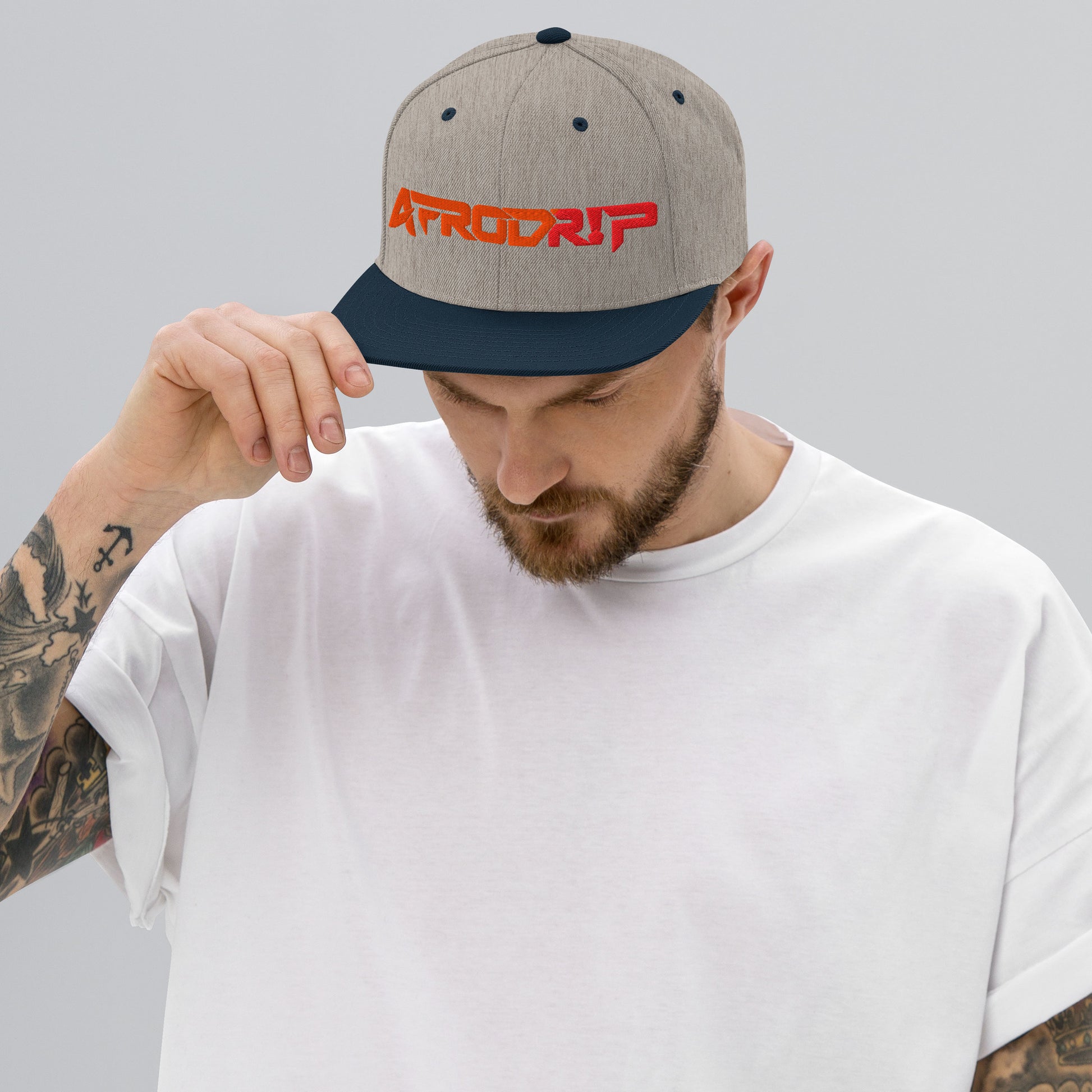 AfroDrip Classic Snapback Hat in black, front view showing embroidered AfroDrip logo on the crown panel