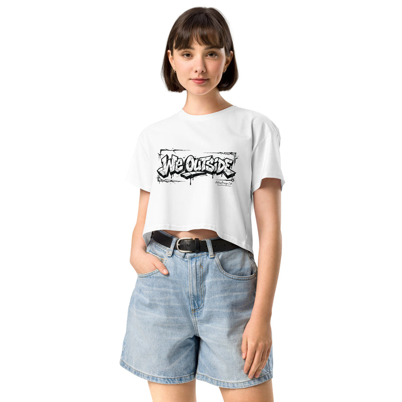 AfroDrip 'We Outside' Women's Crop Top in white, front view showing one-color graffiti graphic print and cropped silhouette